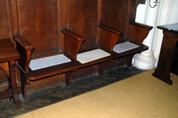 Wooden sedilia on the chancel south wall May 2010